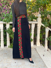 girl wearing a black embroidered maxi skirt