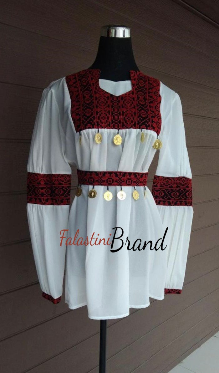 White elegant blouse with red embroidery and stylish coins